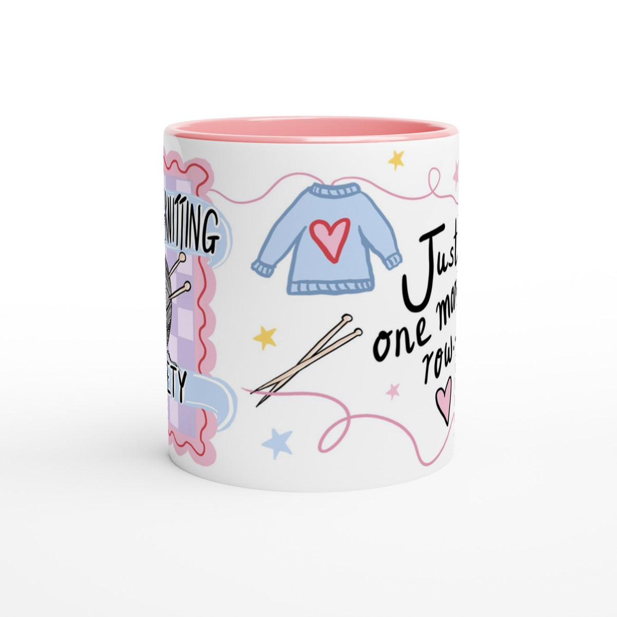 A white ceramic mug with a pink interior, decorated with knitting-themed illustrations including a blue sweater with a red heart, knitting needles, stars, and partial text on a clean white background.